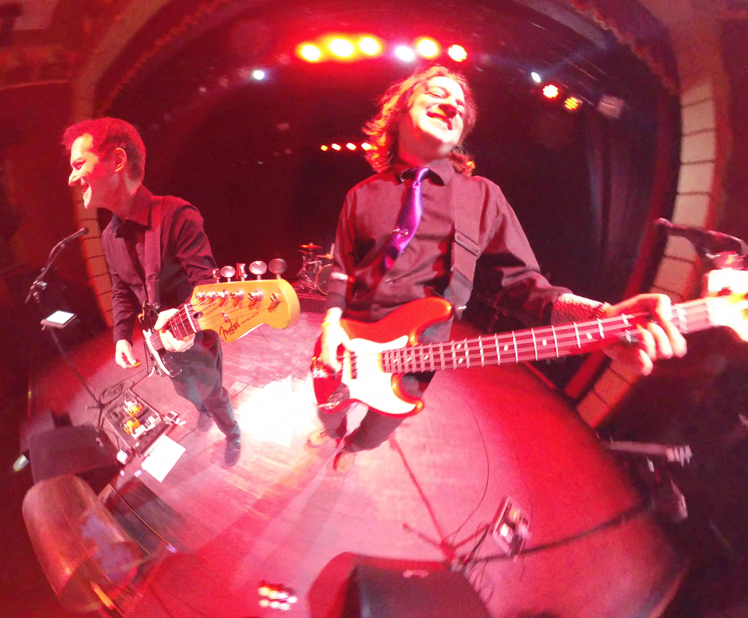 7 Sharp 9 playing under red stage lights, bassist on a red bass