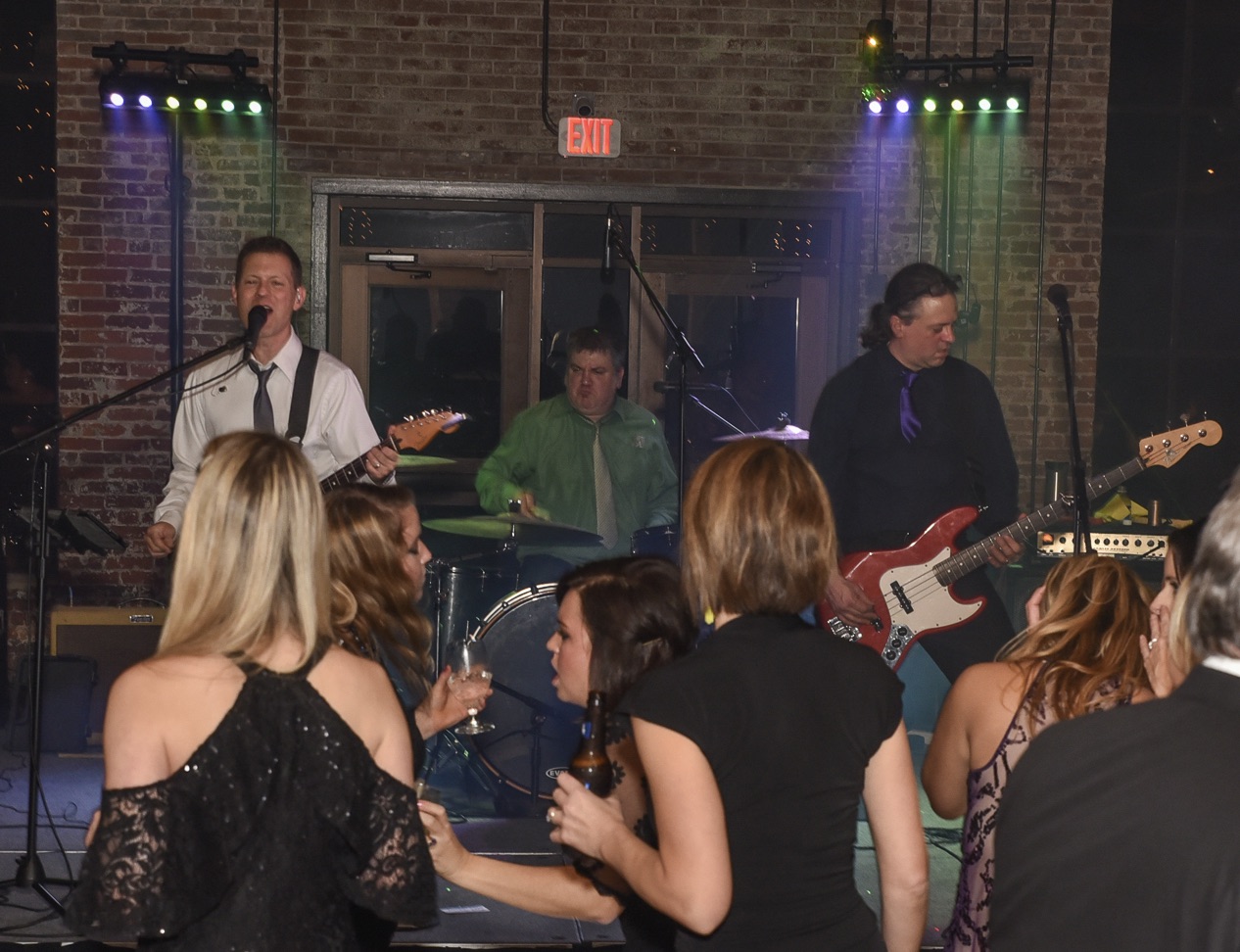 7 Sharp 9 on stage with guests dancing in the foreground
