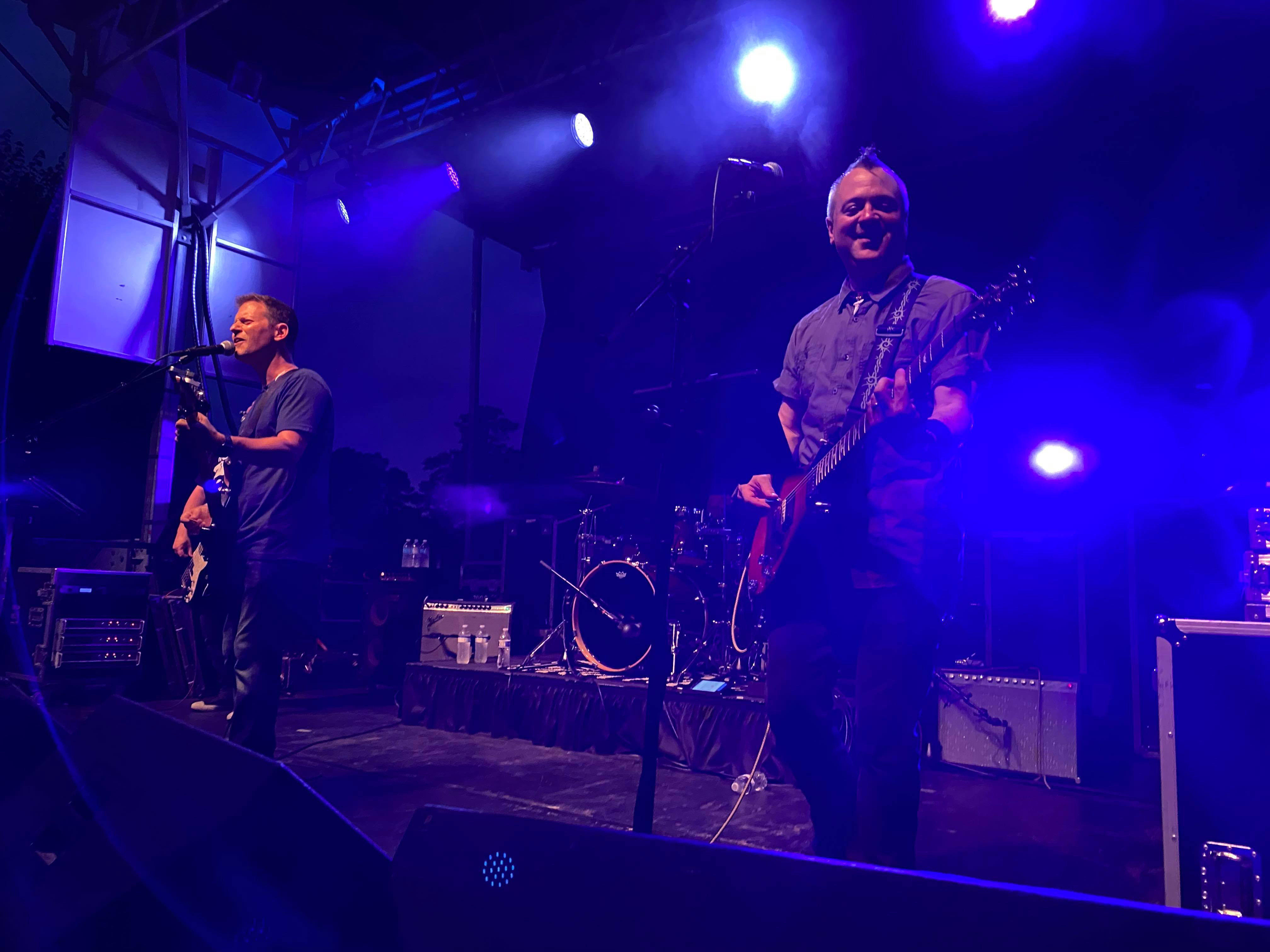 7 Sharp 9 live under blue and purple stage lighting