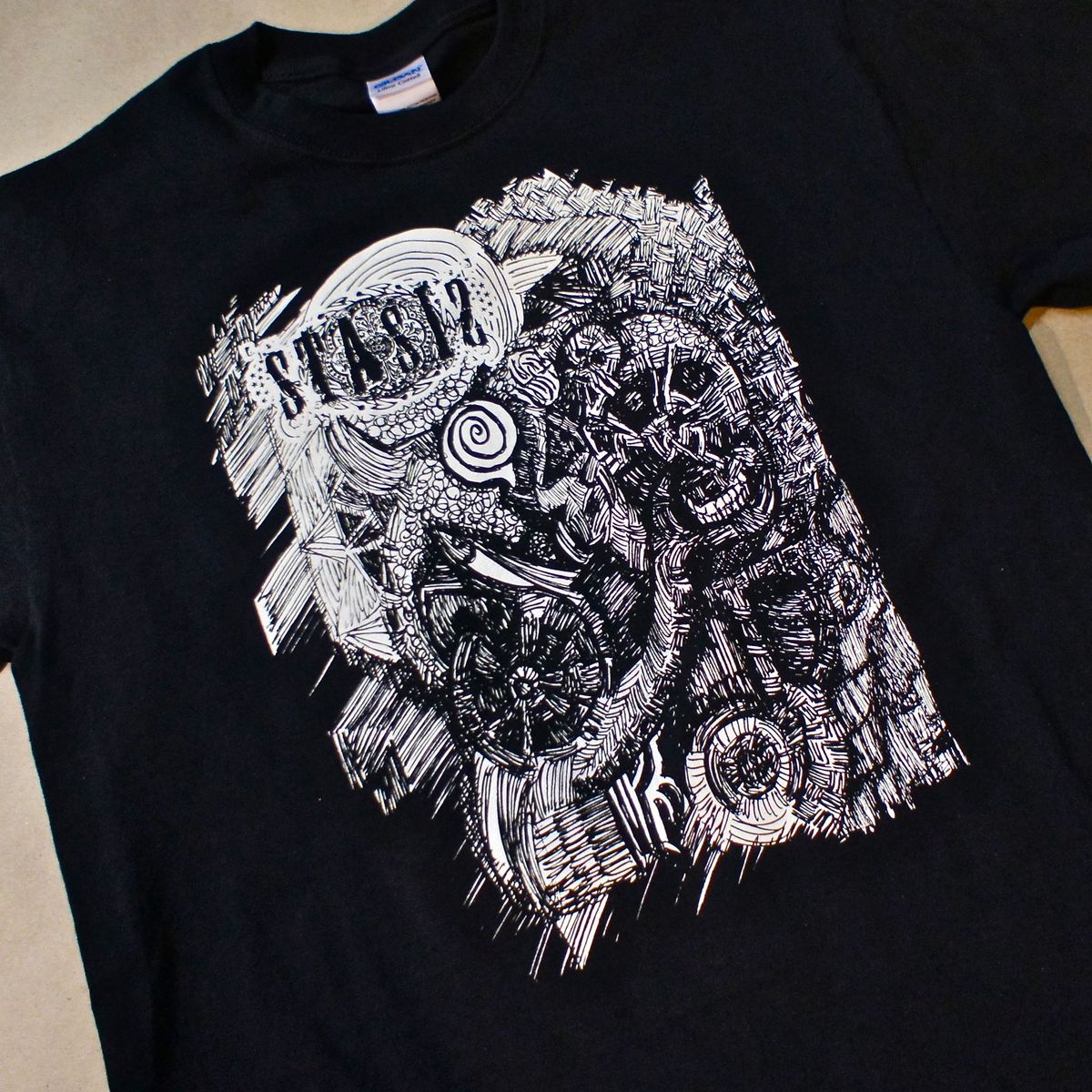 Faces & Skulls T by ERiC C. HARRiSON from GRiEF!