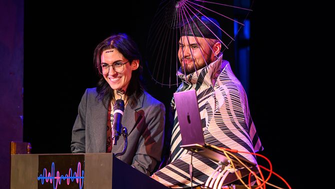 Medusa and M The Myth stand at a podium as hosts of the 2024 Wavy Awards