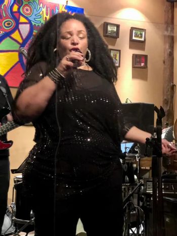 Davina Robinson soul and blues singer performing on stage
