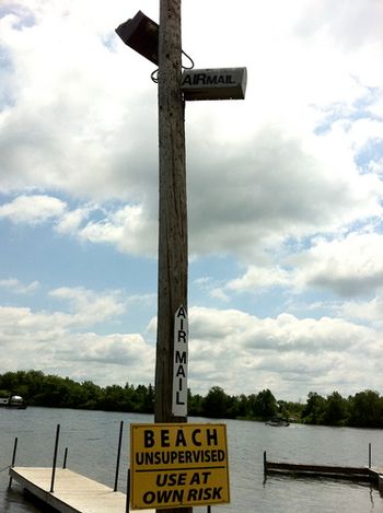 The mailbox at the top of the pole says "Air Mail".
