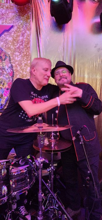 Post-Show Madness. A Gregg Bissonette lesson in peace sign making! He learned from Ringo, the master peacemaker! :)
