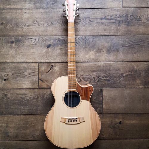 Custom Cole Clark Guitar Angel 2 aka. 'Luna'. Featured in most of Jon's videos. Link is the best comparison.