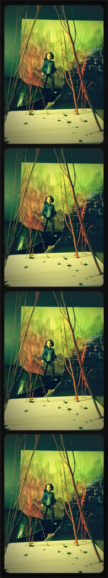 City backdrop was hand-painted. Wire and branches were added as props. To create Felly, Ever After High's Dexter doll was used.
