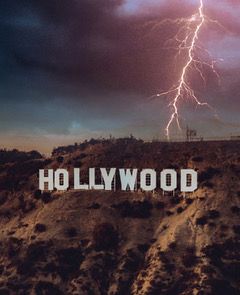 Image: Iconic white letters spelling out "Hollywood" in the Hollywood Hills, struck by a lightning bolt