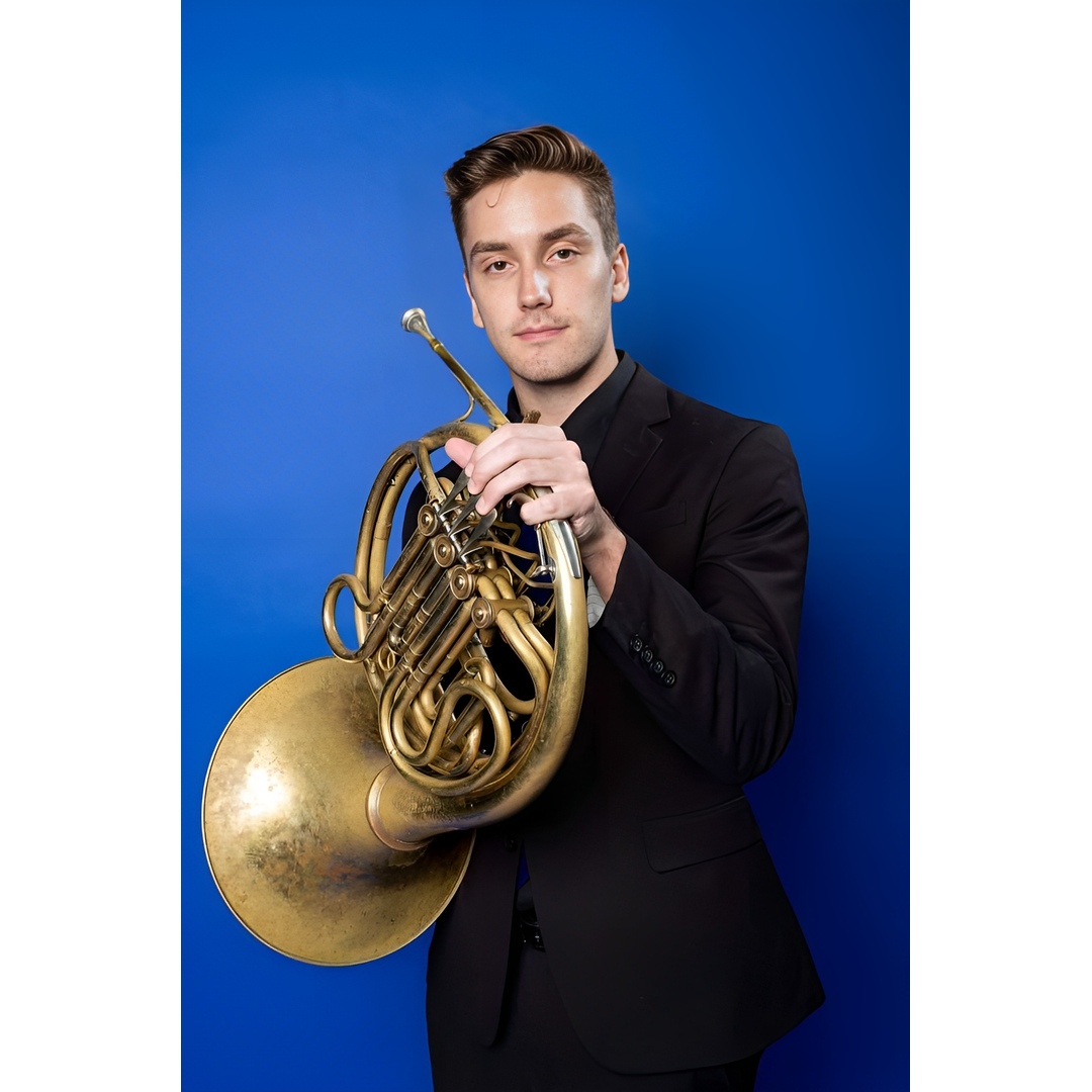 Steve Harmon, a young white man in black holding a French horn