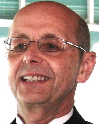Cliff Kern, a smiling white man with a bald head and glasses