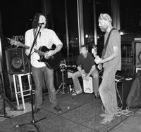 bd Mooney on bass guitar for Travis Bowlin