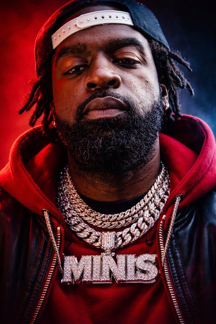 Minis hip hop artist portrait wearing chains promoting Gratitude single independent rapper