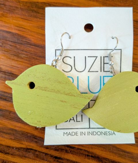 Two wooden earrings featuring a green bird
