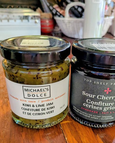 two jars of preserves Kiwi and lime jam and sour cheery jam