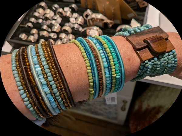Three bracelets on a woman's arm