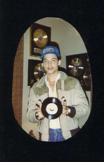 Jon Gibson holding up his first single "She Told Me So" from the "Standing On The One" album.
