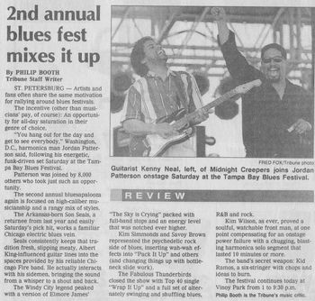 The front cover of the Tribune showcases the moment when Jordan Patterson and his musical friend Kenny Neal performed together at The Tampa Bay Blues Festival in Tampa Bay, Florida, in 1996.
