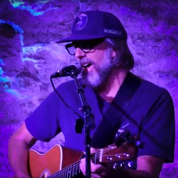 Scott Hall musician and songwriter playing a singing and playing a Martin HD-28 acoustic guitar live
