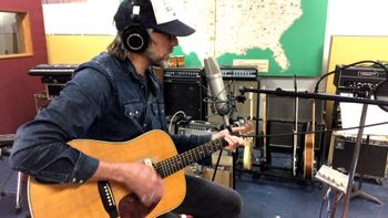 Scott Hall musician and songwriter in the studio playing a Martin HD-28 guitar

