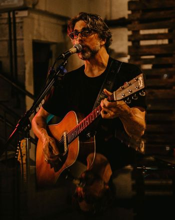 Scott Hall musician and songwriter playing a singing and playing a Martin HD-28 acoustic guitar live
