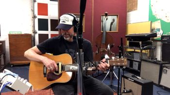 Scott Hall musician and songwriter in the studio playing a Martin HD-28 acoustic guitar
