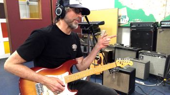 Scott Hall musician and songwriter in the studio playing a Fender Stratocaster guitar

