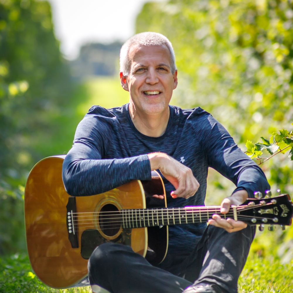 Mike Lucey Sitting in a Vineyard