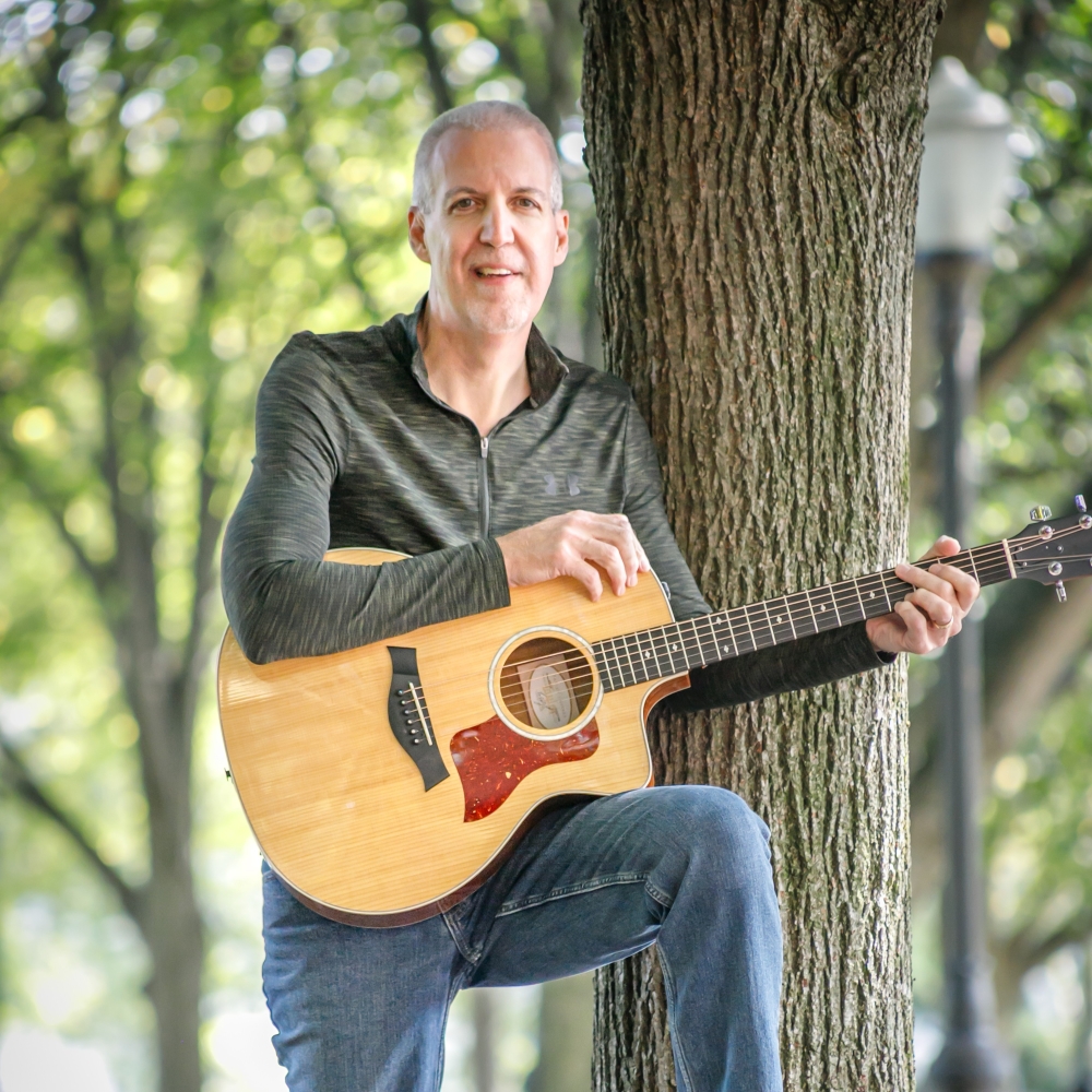 Mike Lucey by a Tree in a Park