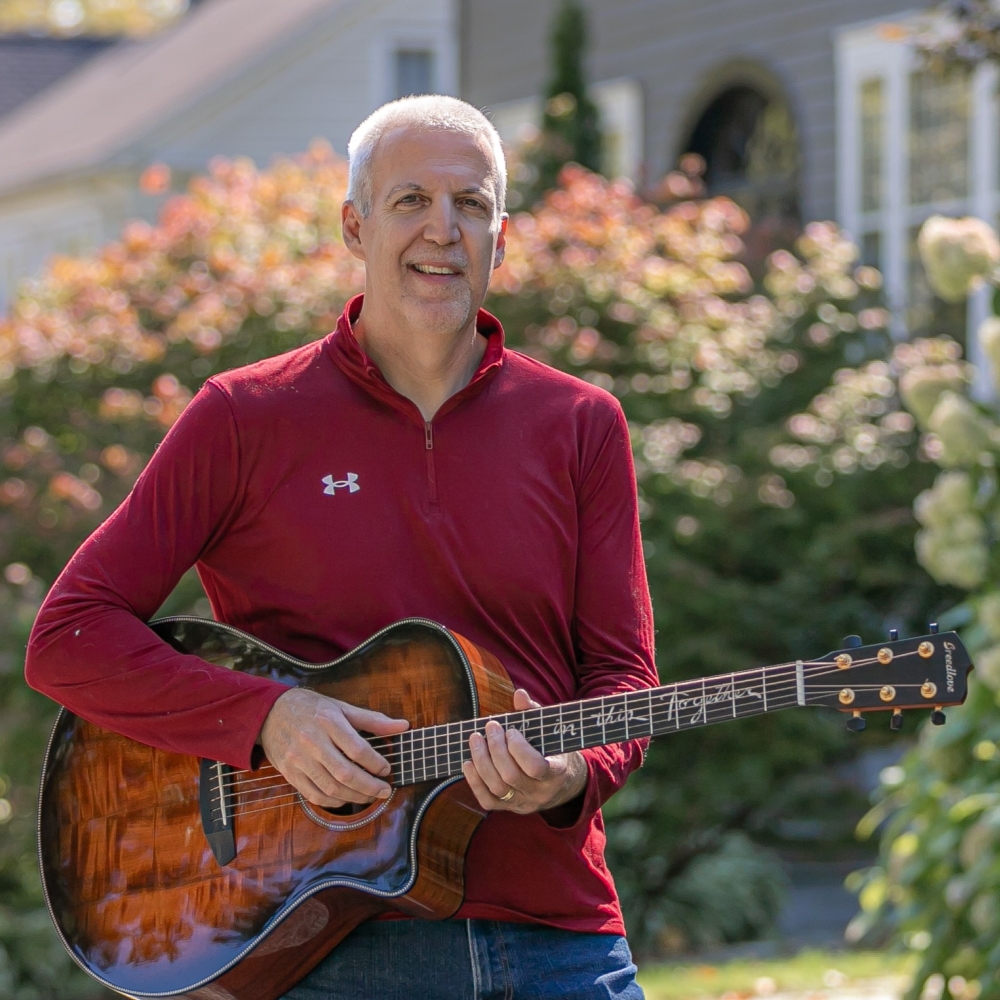 Mike Lucey on a Sidewalk with a Breedlove Acoustic