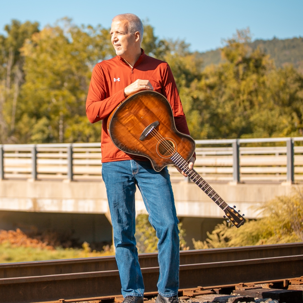 Mike Lucey Standing at RR Tracks with Breedlove Acoustic