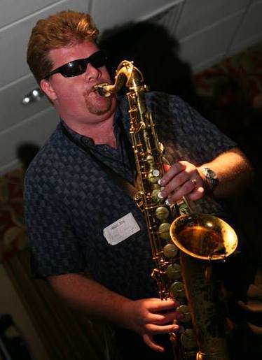 Brian Grace playing sax at a Rundgren Radio event