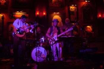 Steven Burns, Erik Januszko, Joe Bernal, Dave Seely (left to right). Steven is playing the slide using a tabasco bottle.
