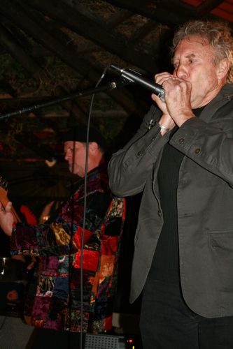 Budd Willis blowing the harp with Steve Burns at Downtown Cafe
