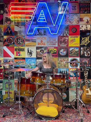 Lily playing drums in Austin
