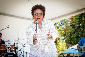 Drini enjoying singing at the FREMONT FESTIVE OF THE ARTS August 2024
