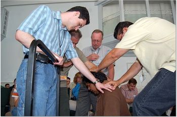 Allison called up all the ordained ministers to pray for Wes and ordain him in front of this body of believers.
