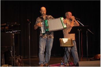 Classical music being played on two classical instruments, the accordion and the harmonica.
