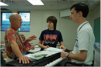 Jack Clark explaining to Raluca and Daniel how the piano works.
