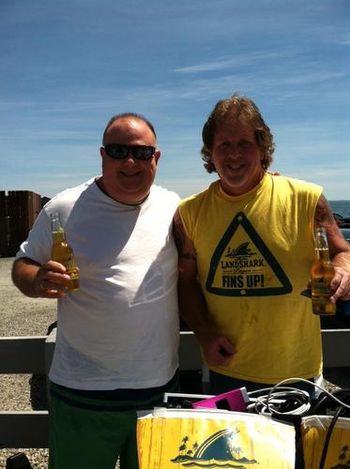 A deciple and long time parrot head, Tom Revane now a Landshark Beer sponsered show, rocks Marleys on the beach... Fins up Tom
