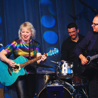 Vickie Maris and Scott Greeson with members of the band