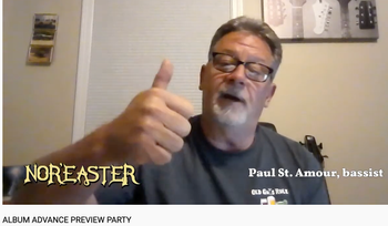 Bassist Paul St. Amour salutes the team during the Album Advance Preview Party livestream
