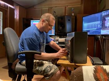 Dustin cleaning the 8-track machine before beginning the search for a missing track.

