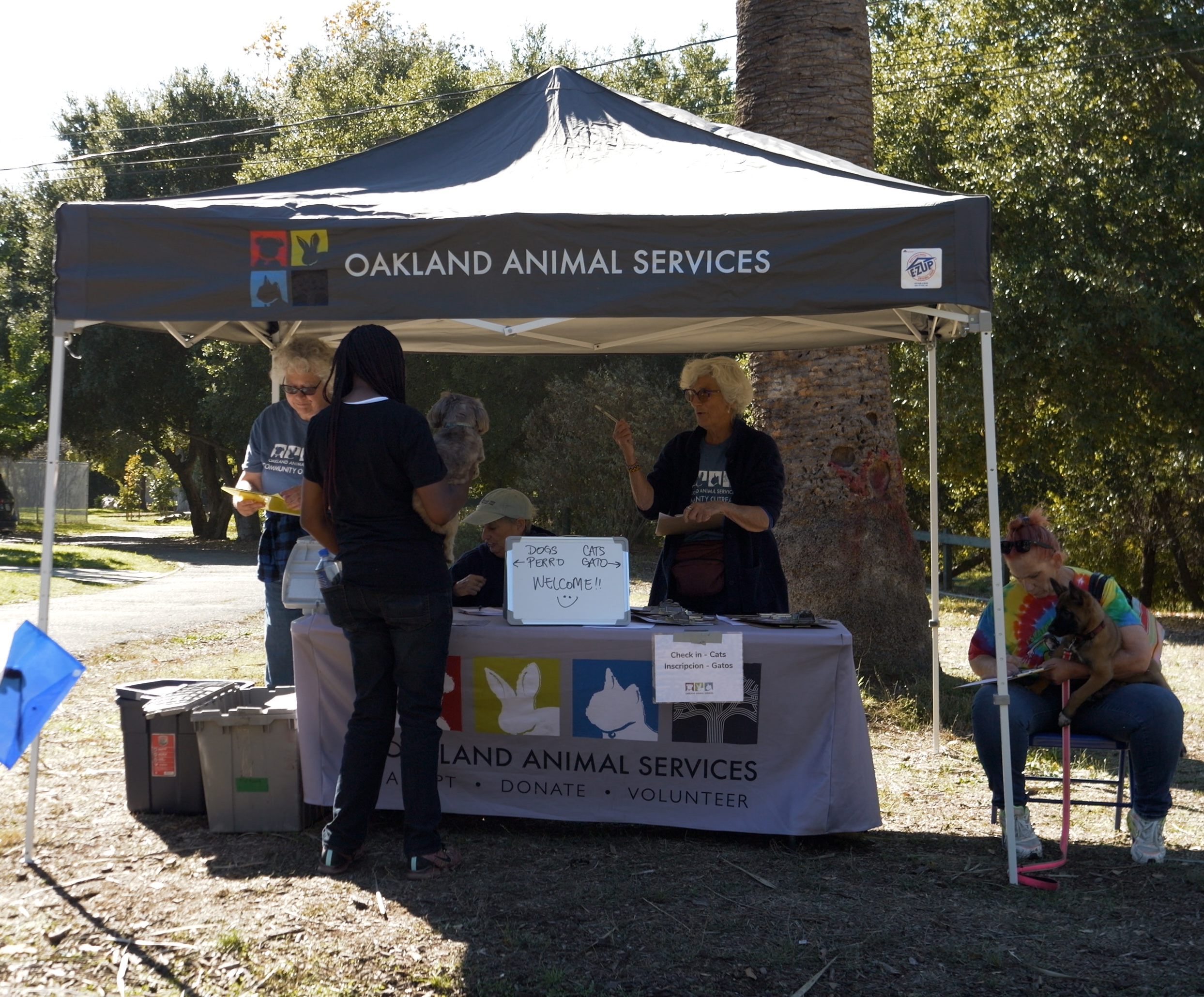 Photo of Oakland Animal Services Tent in the park.