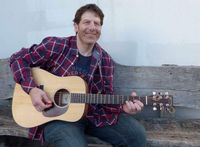 Dan Israel plays at the National Night Out event at his condo in St. Louis Park