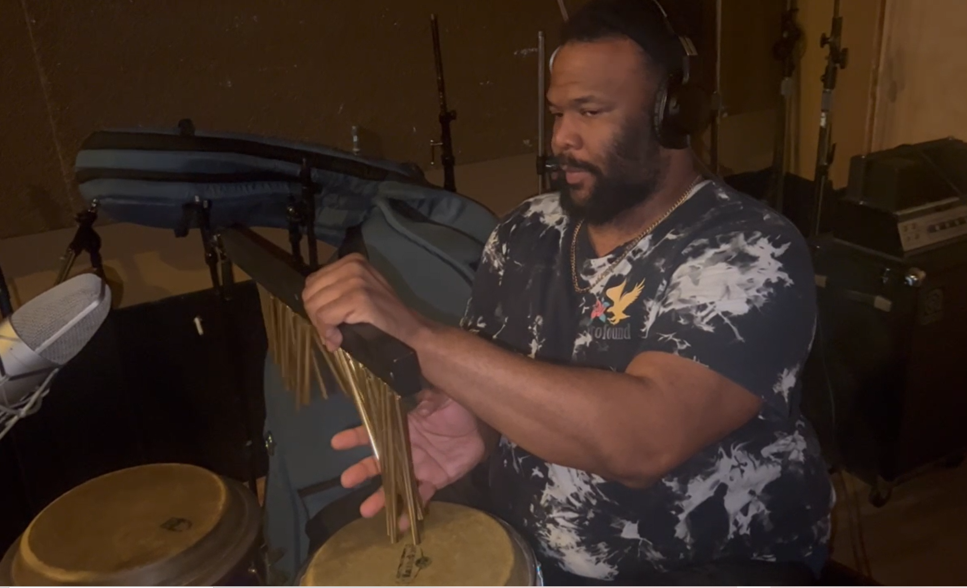 A person playing drums

Description automatically generated