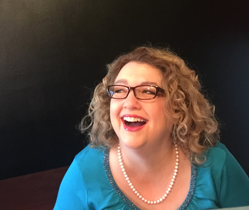 She won't say what she's laughing about!
