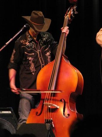 Riley Tubbs bowing the strings
