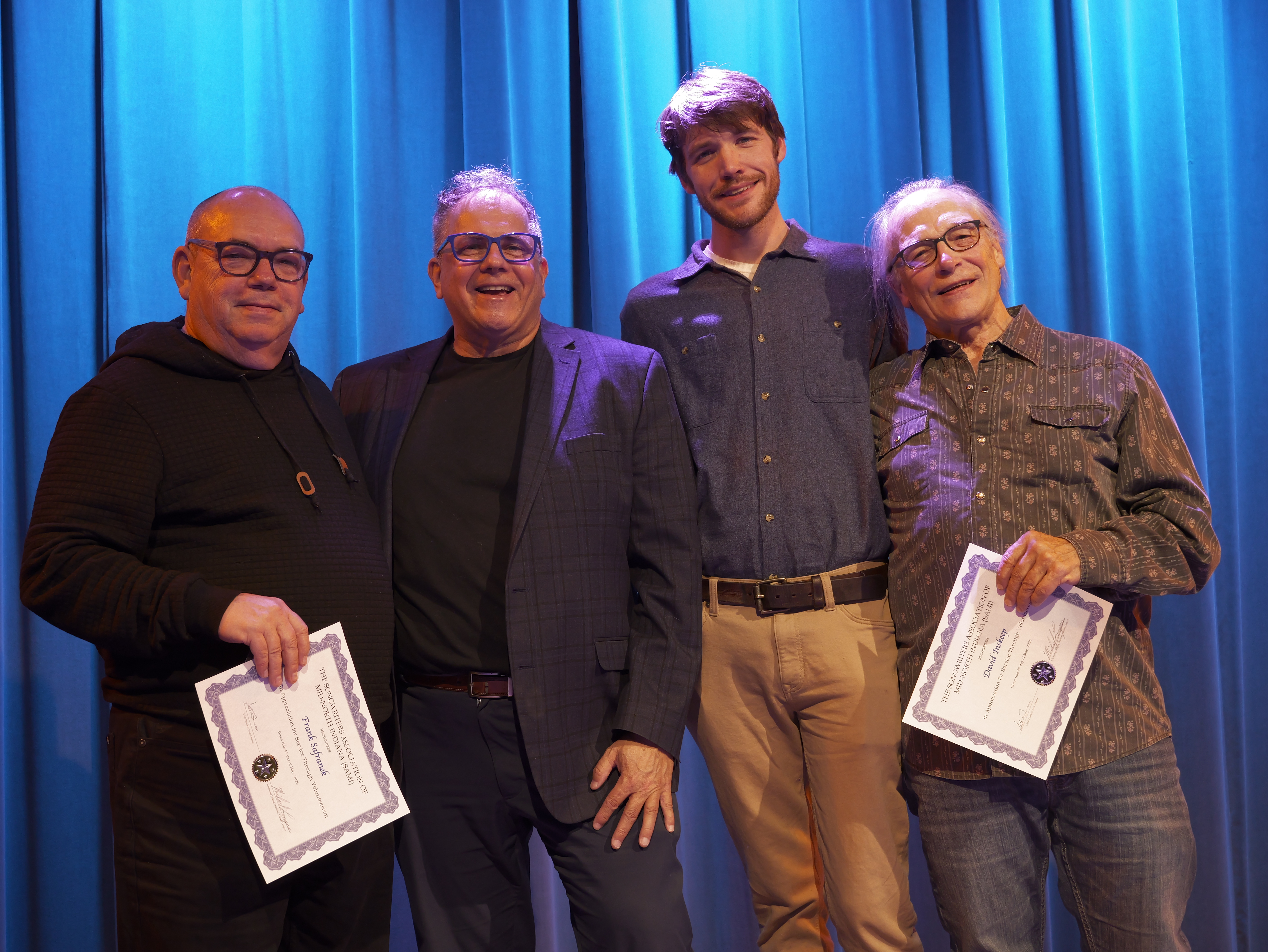 Scott Greeson and Sam Bennett pose with Frank Safranek and David Inskeep, who both hold certificates
