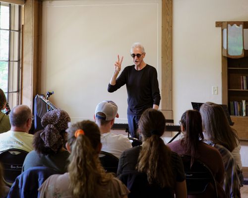 Joe Peters lectures to attendees of the Keep Looking Up: Songwriting Retreat in Ross House at Ross Hills Park