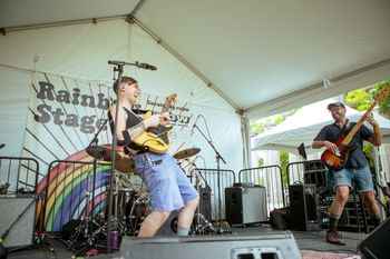 Guitarist Margot Biever (she/her) and bassist Zach Goforth (he/him) at Nashville Pride 2024. (Ian's back there somewhere.)
