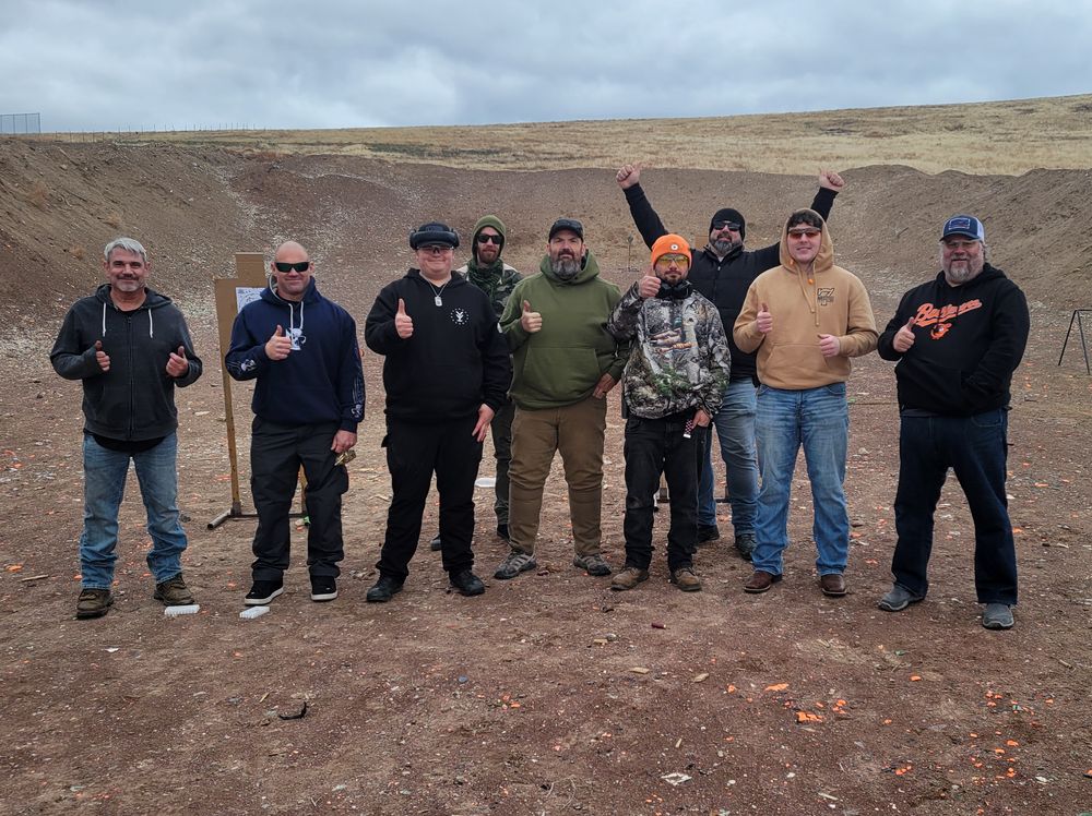 a group of tvsa students posing for a group photo after completing a Practical Pistol course